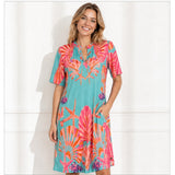 Angelle Milan Travelstof Jurk - Turquoise Koraal Bloemenprint